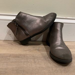 Beautiful shiny silver boots.